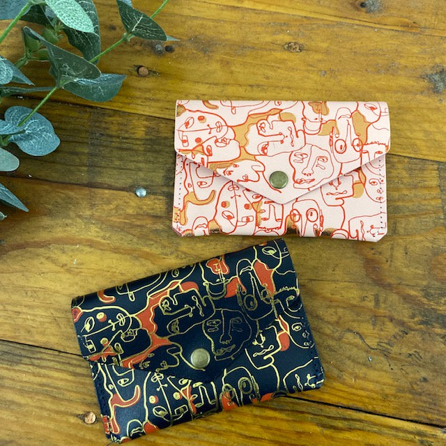 Many Faces Popper Purse