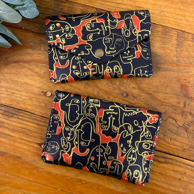 Many Faces Popper Purse