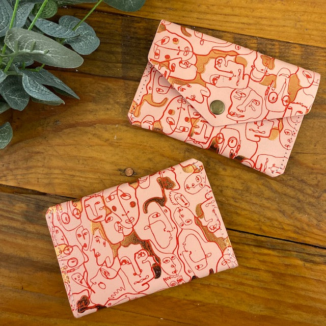 Many Faces Popper Purse